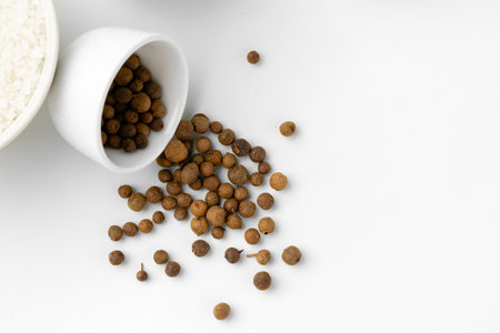 Pile of allspice isolated on white backgroundの写真素材