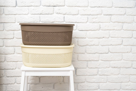 Plastic storage baskets in a bathroom interiorの写真素材