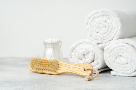 Stacked clean fluffy towels in a bathroomの写真素材