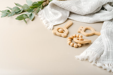 Baby muslin blanket and wooden toys for newborn