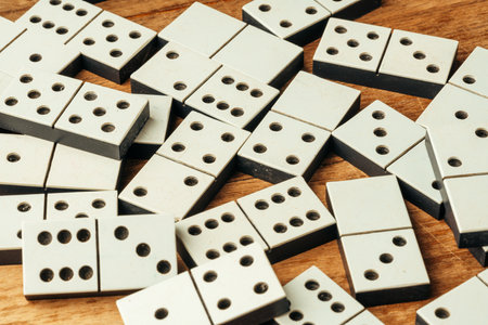 Domino game on brown wooden background close upの写真素材