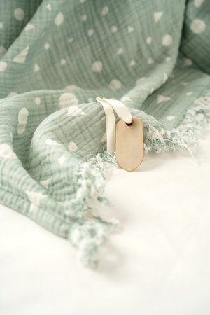 Muslin baby cotton blanket on white backgroundの写真素材