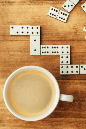 Domino game on brown wooden background close upの写真素材