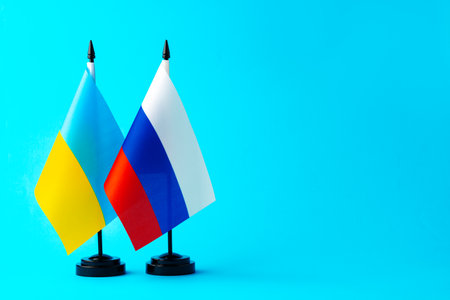 Small flags of Russia and Ukraine on flagpolesの写真素材