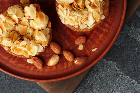 Tart pie with almond petals on plateの写真素材