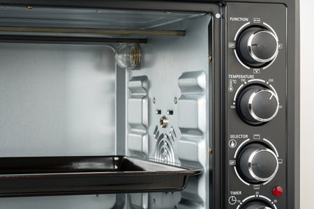Close up of black electric oven home applianceの写真素材