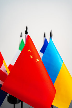 Lots of small national flags on tableの写真素材