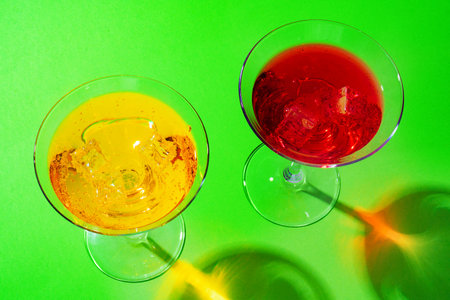 Cold and refreshing cocktails on color backgroundの写真素材