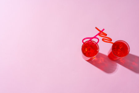Summer drinks with straws on color backgroundの写真素材