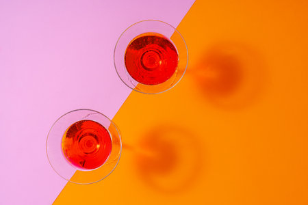 Refreshing pink punch cocktail on color backgroundの写真素材