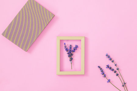Lavender flowers on pink background, top viewの写真素材