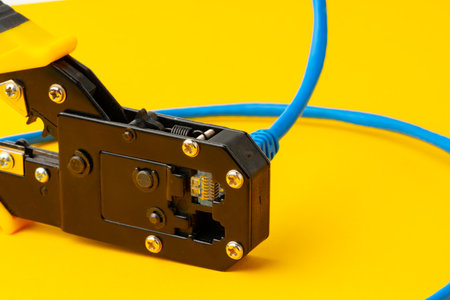 Cutting pliers cut electric cable close up