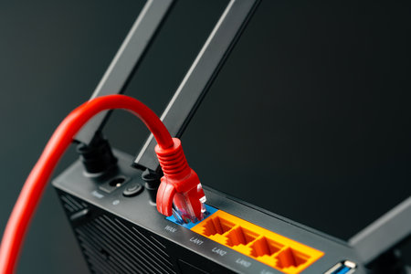 Modern router with cables plugged in close upの写真素材