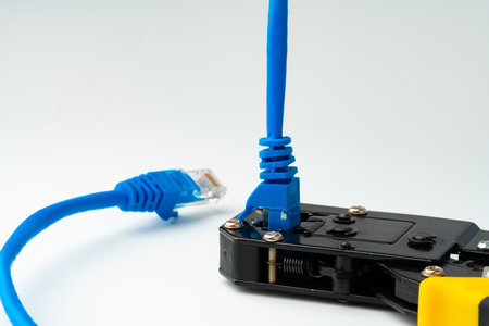 Cutting pliers cut electric cable close up