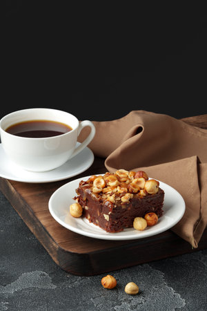 Brownie cake with chocolate and hazelnuts on plateの写真素材