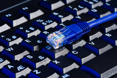 Modern technology network cable in neon light.の写真素材