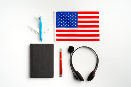 Flag of USA and headset on white backgroundの写真素材