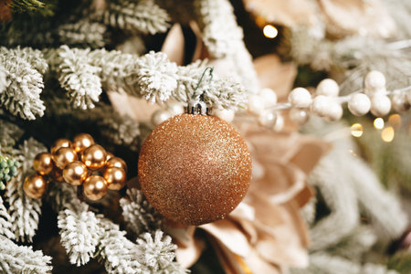 Beautiful Christmas tree with golden balls decor close upの写真素材