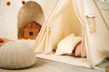 Childrens room with play tent teepee and pillows