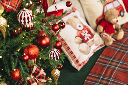 Teddy bear on bed with pillows for Christmas decoration