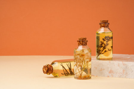 Essential oil glass bottle on beige background.の写真素材