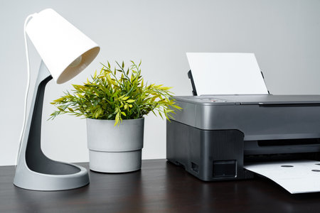 Printer with paper on gray background close upの写真素材