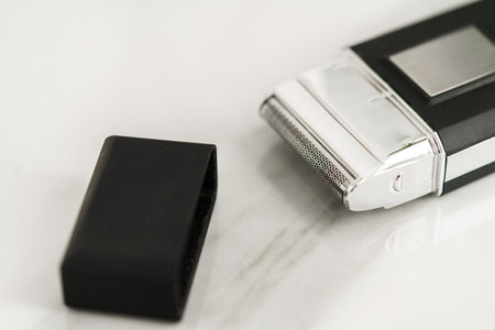 Electric shaver for men in a bathroom close upの写真素材