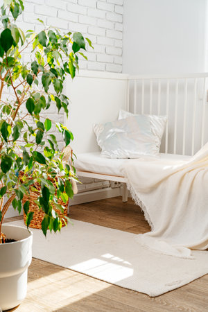 Soft cotton blanket hanging on babys bedの写真素材