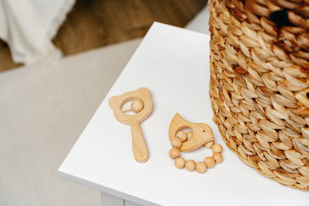 Wooden rattle toys for little kids on the night standの写真素材