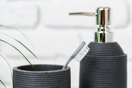 Soap dispenser container n the bathroom close up