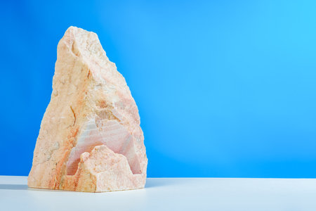 Pieces of granite stone against blue backgroundの写真素材