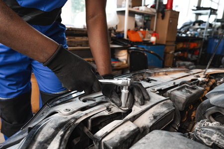Close up of hands of auto mechanic working in a garageの写真素材