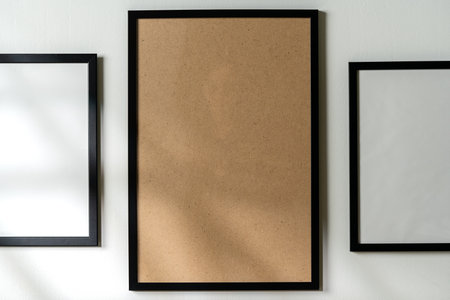 Blank picture frames on the white wall copy spaceの写真素材