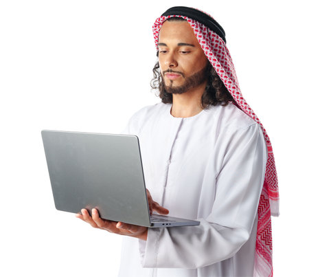 Arab man wearing traditional clothes using laptop isolated on white backgroundの写真素材