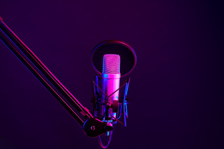 Professional microphone against black background in studioの写真素材
