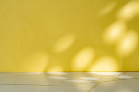 Abstract shadow from the window on yellow backgroundの写真素材