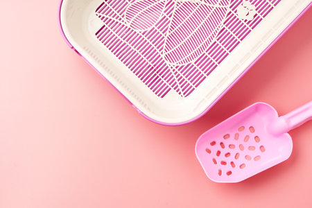 Empty pet litter box on pink backgroundの写真素材