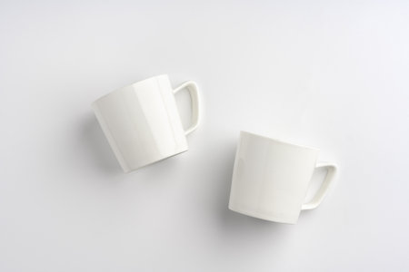 Blank white mugs mock up on white background
