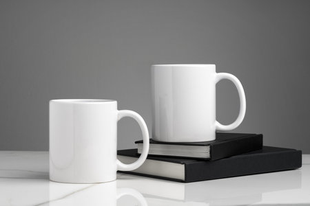 Ceramic cups on marble table against gray backgroundの写真素材