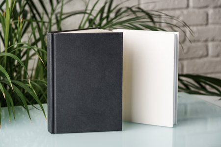 Tropical palm leaves and blank notepad mock up