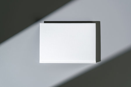 White notepad with hard cover on gray backgroundの写真素材