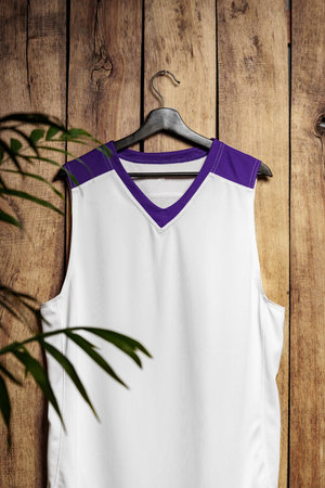 Basketball jersey on hanger against wooden backgroundの写真素材