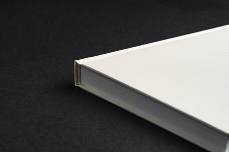 Hardcover book or notepad mock up on black backgroundの写真素材