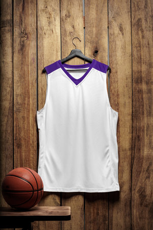 Basketball jersey on hanger against wooden backgroundの写真素材