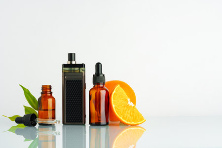 Vape liquid with orange flavor on white background