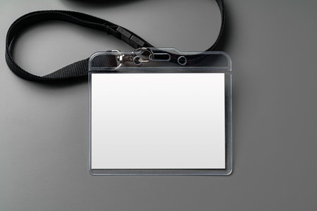 Blank nametag on gray background copy space