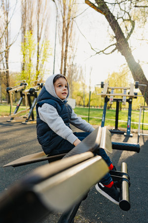A little boy on the sports ground in park