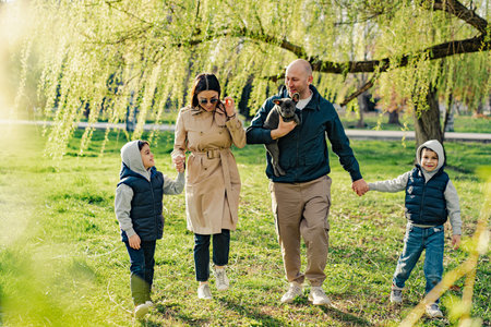 Happy family on a walk in the parkの写真素材