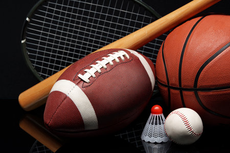 Various sports equipment on black background studio shotの写真素材