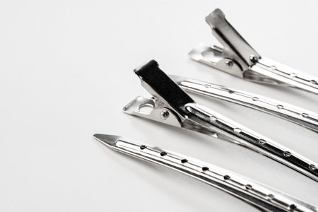 Close up of metal hair clips isolated on white backgroundの写真素材